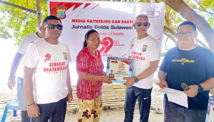 Jurnalis Polda Sulut Tebar Kepedulian di Desa Bukit Tinggi, Nelayan Tersentuh Jelang Hari Bhayangkara ke-79