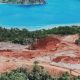 Pemandangan udara tambang nikel di Pulau Gag, Raja Ampat, menunjukkan bekas pembukaan lahan di kawasan hutan lindung.