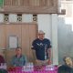 Suasana sosialisasi LAKRI Minahasa di Desa Atep Oki, warga berkumpul mendengarkan pemaparan tentang transparansi pembangunan desa.