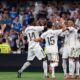 Kylian Mbappé rayakan gol debut bersama Real Madrid lewat penalti saat melawan Osasuna di Santiago Bernabéu.