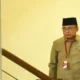 Mantan Menteri Agama Yaqut Cholil Qoumas berjalan menuju ruang pemeriksaan di Gedung Merah Putih KPK, Jakarta, Selasa (16/12/2025)